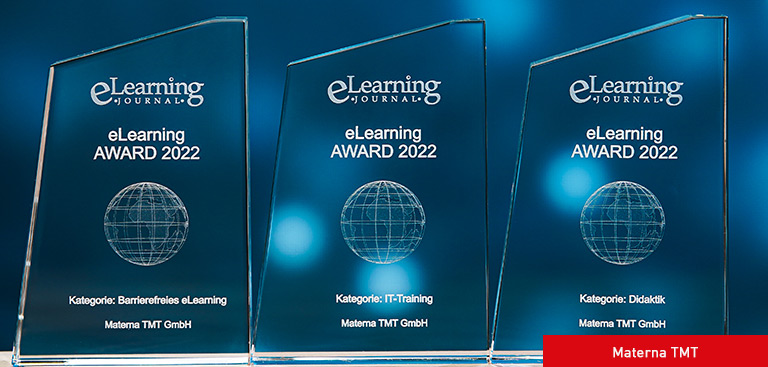 3 E-Learning Awards auf einem Tisch: Materna TMT wurde 2022 mehrfach ausgezeichnet
